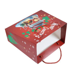 El tamaño modificado para requisitos particulares personalizó el material impreso del papel revestido de los bolsos del regalo para la Navidad proveedor