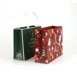 Peso modificado para requisitos particulares biodegradable de empaquetado de los bolsos del regalo del papel popular para la Navidad proveedor