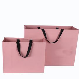 El bolso rosado de la cartulina del color laminado imprimió el lujo para hacer compras/regalo proveedor