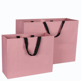 El bolso rosado de la cartulina del color laminado imprimió el lujo para hacer compras/regalo proveedor
