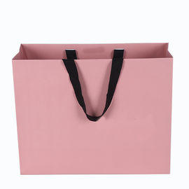El bolso rosado de la cartulina del color laminado imprimió el lujo para hacer compras/regalo proveedor