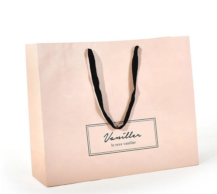 La manija plana del algodón crea las bolsas de papel para requisitos particulares, color rosado de papel impreso de los bolsos de compras proveedor