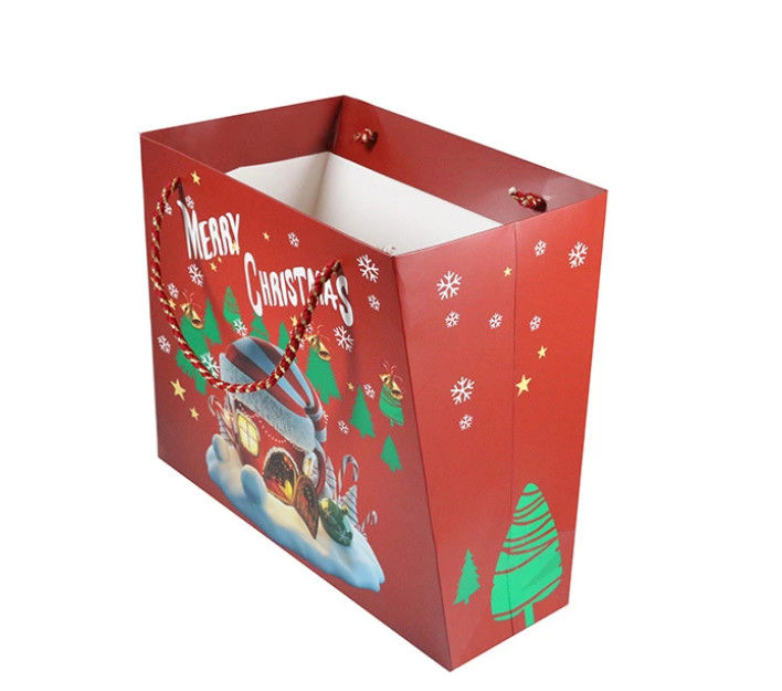 El tamaño modificado para requisitos particulares personalizó el material impreso del papel revestido de los bolsos del regalo para la Navidad proveedor