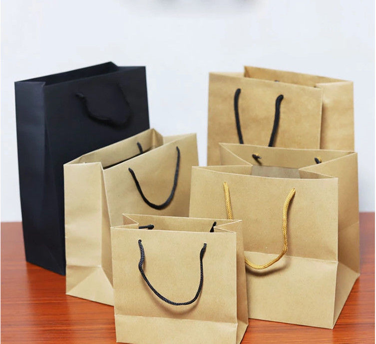 Alta resistencia de rasgón amistosa impresa de Eco de las bolsas de papel de Kraft de la durabilidad aduana alta proveedor